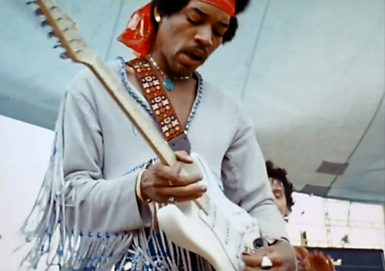 Jimi Hendrix playing his Fender Stratocaster at Woodstock