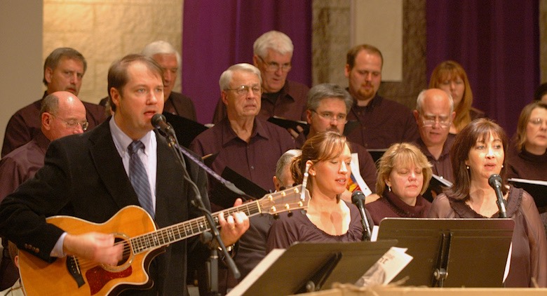 leading worship with a guitar